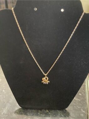 Nina Ricci Gold-Tone Pendant Necklace with Signature Bow & NR Logo